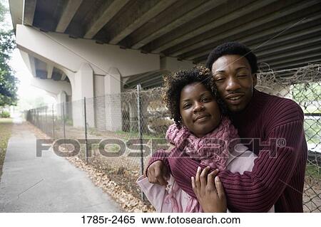Young couple standing under a highway overpass View Large Photo Image Stock Photography - Young couple standing under a highway overpass. Fotosearch
