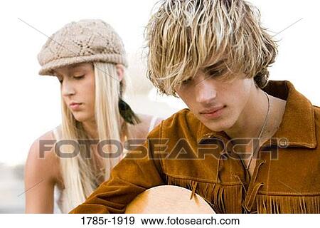 Young hippie couple with guitar View Large Photo Image Stock Photo - Young hippie couple with guitar. Fotosearch