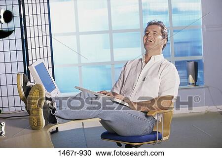 Young man laughing View Large Photo Image Stock Image - Young man laughing. Fotosearch