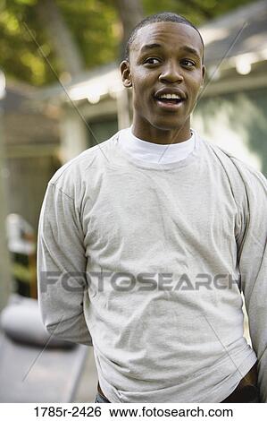 Stock Photograph - Young man smiling. Fotosearch