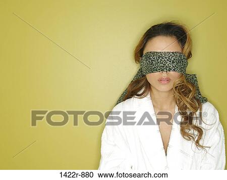Stock Image - Young woman blindfolded. Fotosearch