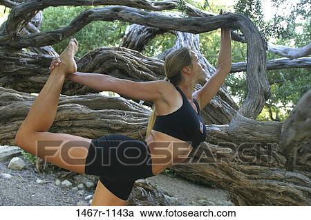 Young woman exercising outdoors View Large Photo Image Stock Image - Young woman exercising outdoors. Fotosearch