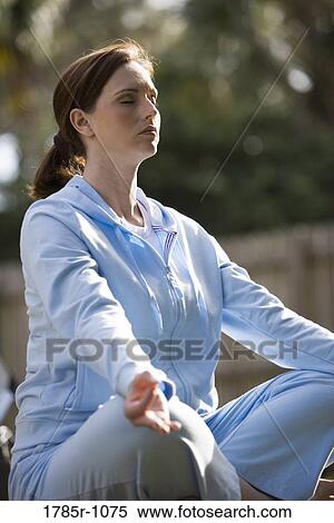 Stock Photography - Young woman in a yoga position. Fotosearch