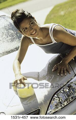 Young woman washing a car View Large Photo Image Stock Photo - Young woman washing a car. Fotosearch