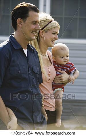 A family standing together View Large Photo Image Picture - A family standing together. Fotosearch