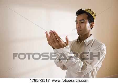 A Muslim man praying View Large Photo Image Stock Photo - A Muslim man praying. Fotosearch