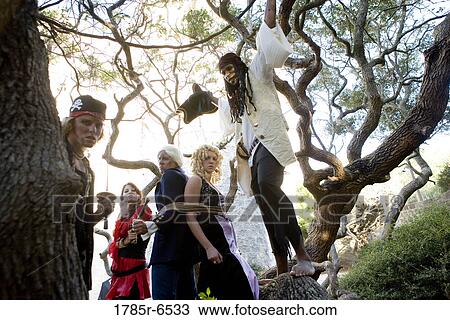 A princess in a purple gown and a navy officer held captive by armed pirates View Large Photo Image Stock Image - A princess in a purple gown and a navy officer held captive by armed pirates. Fotosearch