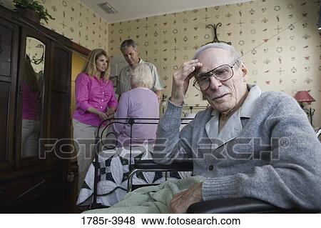 Adult children visiting and comforting senior parents in bedroom View Large Photo Image Stock Photo - Adult children visiting and comforting senior parents in bedroom. Fotosearch