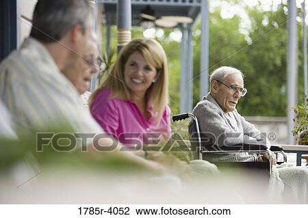 Adult children visiting with elderly parents View Large Photo Image Stock Image - Adult children visiting with elderly parents. Fotosearch