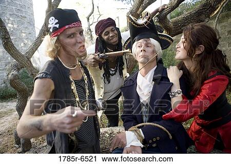 Armed pirates holding a navy officer as hostage and threatening him with weapons View Large Photo Image Stock Image - Armed pirates holding a navy officer as hostage and threatening him with weapons. Fotosearch