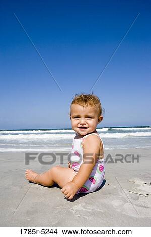 Baby on beach View Large Photo Image Picture - Baby on beach. Fotosearch