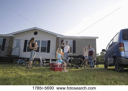 Blue collar families enjoying a cookout in front of trailer home View Large Photo Image Stock Image - Blue collar families enjoying a cookout in front of trailer home. Fotosearch