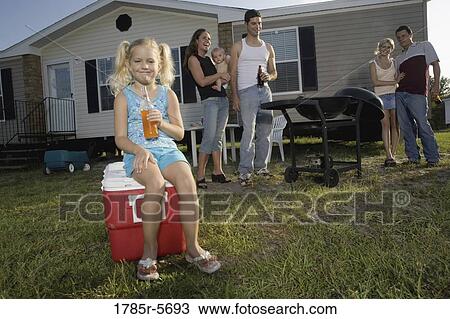 Blue collar families enjoying a cookout in front of trailer home View Large Photo Image Stock Image - Blue collar families enjoying a cookout in front of trailer home. Fotosearch