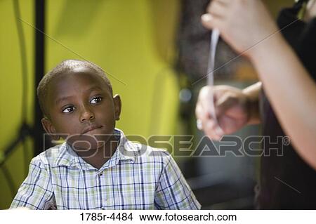 Boy (5-6) watching and listening attentively to his teacher View Large Photo Image Picture - Boy (5-6) watching and listening attentively to his teacher. Fotosearch