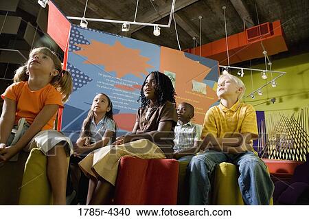Boys and girls watching and listening attentively in a class View Large Photo Image Stock Image - Boys and girls watching and listening attentively in a class. Fotosearch