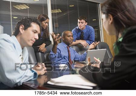 Business colleagues at a working meeting in a conference room View Large Photo Image Picture - Business colleagues at a working meeting in a conference room. Fotosearch