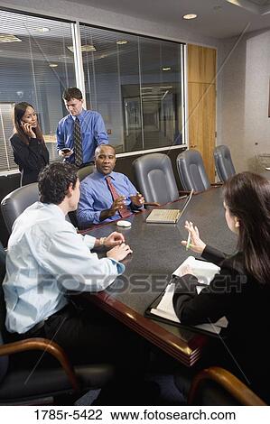 Business colleagues at a working meeting in a conference room View Large Photo Image Stock Image - Business colleagues at a working meeting in a conference room. Fotosearch