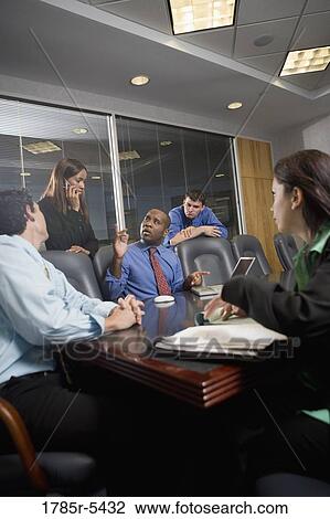 Business colleagues at a working meeting in a conference room View Large Photo Image Stock Image - Business colleagues at a working meeting in a conference room. Fotosearch