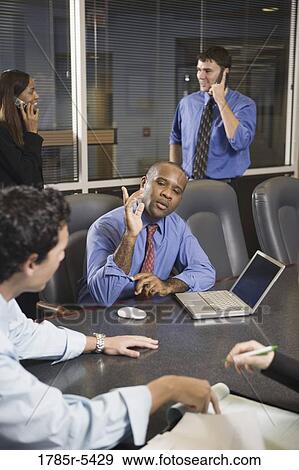 Business colleagues at a working meeting in a conference room View Large Photo Image Stock Photo - Business colleagues at a working meeting in a conference room. Fotosearch