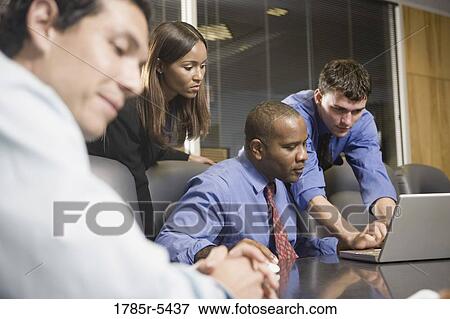 Business colleagues at a working meeting in a conference room View Large Photo Image Stock Photo - Business colleagues at a working meeting in a conference room. Fotosearch