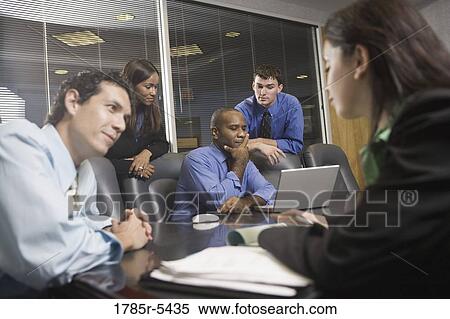 Business colleagues at a working meeting in a conference room View Large Photo Image Stock Photography - Business colleagues at a working meeting in a conference room. Fotosearch