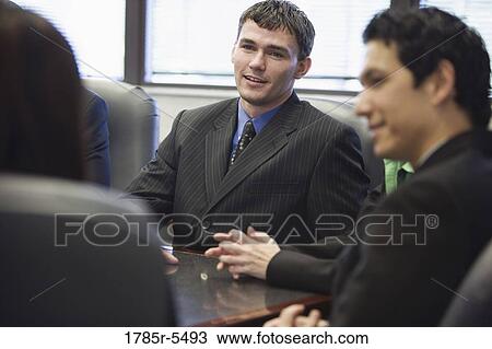 Business executives at a meeting View Large Photo Image Stock Image - Business executives at a meeting. Fotosearch