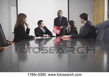 Business executives at a presentation in a formal conference room View Large Photo Image Stock Photography - Business executives at a presentation in a formal conference room. Fotosearch