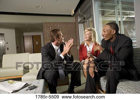 Business executives having discussion View Large Photo Image Stock Photo - Business executives having discussion. Fotosearch