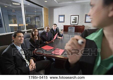 Business men and women at a presentation in a formal conference room View Large Photo Image Stock Photography - Business men and women at a presentation in a formal conference room. Fotosearch