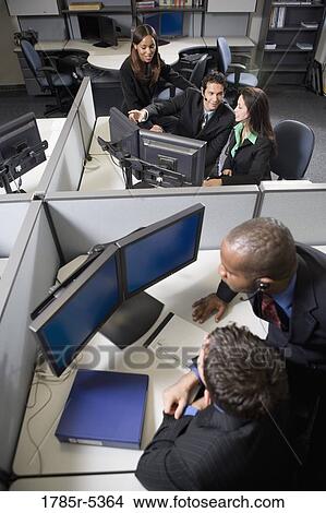 Picture - Business people working in a busy office. Fotosearch