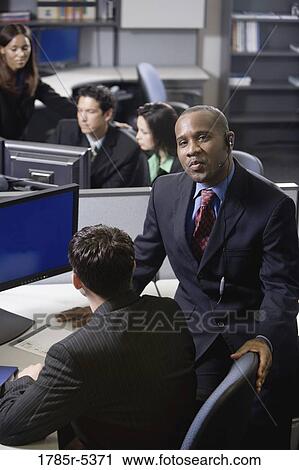 Business people working in a busy office View Large Photo Image Stock Image - Business people working in a busy office. Fotosearch