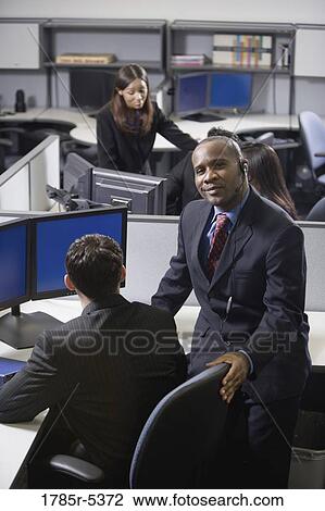 Business people working in a busy office View Large Photo Image Stock Image - Business people working in a busy office. Fotosearch