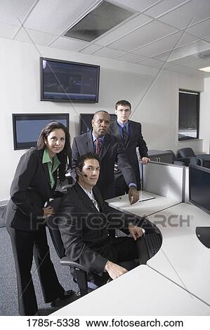 Business people working in a busy office View Large Photo Image Stock Photo - Business people working in a busy office. Fotosearch