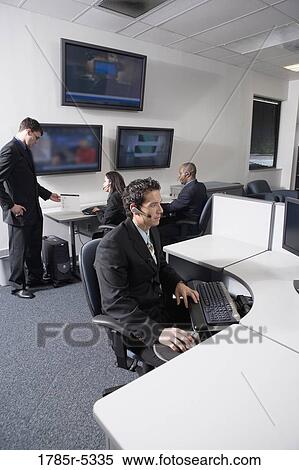 Business people working in a busy office View Large Photo Image Stock Photography - Business people working in a busy office. Fotosearch