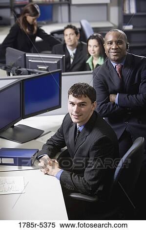 Business people working in a busy office View Large Photo Image Stock Photography - Business people working in a busy office. Fotosearch