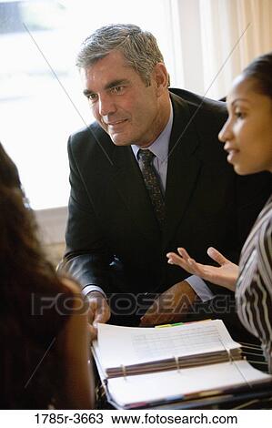 Businessman and businesswoman in meeting View Large Photo Image Stock Image - Businessman and businesswoman in meeting. Fotosearch