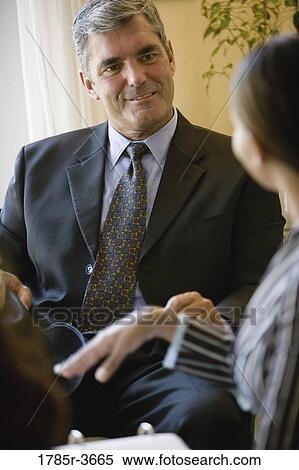 Businessman and businesswoman in meeting View Large Photo Image Stock Photography - Businessman and businesswoman in meeting. Fotosearch