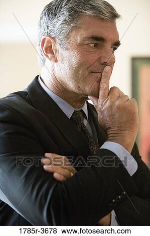 Stock Photo - Businessman in contemplative mood. Fotosearch