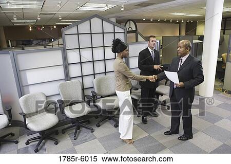 Stock Photography - Businesspeople shaking hands. Fotosearch
