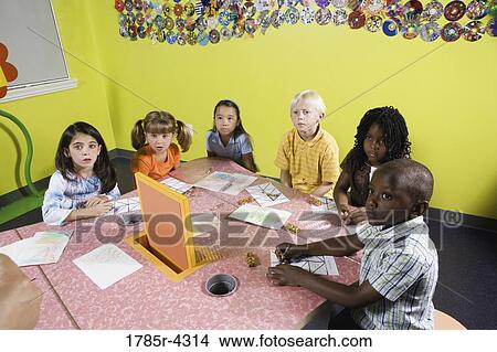 Children drawing and paying attention in class View Large Photo Image Picture - Children drawing and paying attention in class. Fotosearch