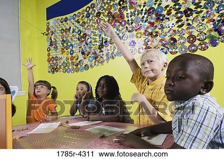 Children drawing and paying attention in class View Large Photo Image Stock Image - Children drawing and paying attention in class. Fotosearch