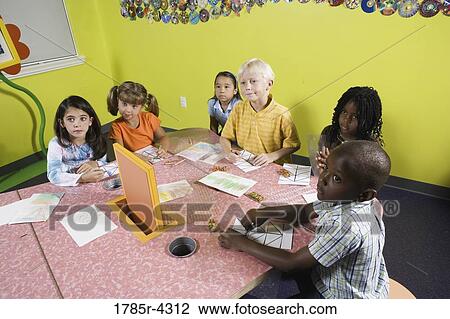 Children drawing and paying attention in class View Large Photo Image Stock Image - Children drawing and paying attention in class. Fotosearch