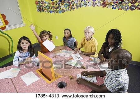 Children drawing and paying attention in class View Large Photo Image Stock Image - Children drawing and paying attention in class. Fotosearch
