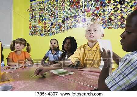 Children drawing and paying attention in art class View Large Photo Image Stock Photo - Children drawing and paying attention in art class. Fotosearch