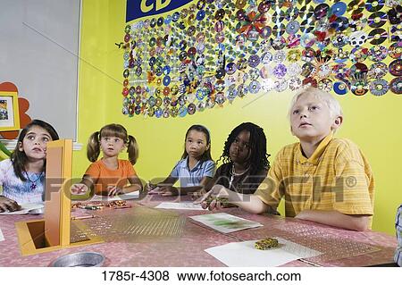 Children drawing and paying attention in art class View Large Photo Image Stock Photo - Children drawing and paying attention in art class. Fotosearch
