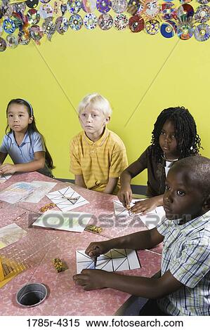 Children drawing and paying attention in class View Large Photo Image Stock Photography - Children drawing and paying attention in class. Fotosearch