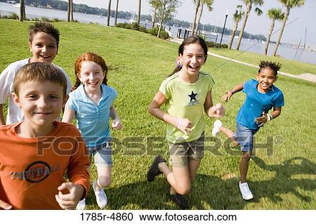 Children running towards the viewer View Large Photo Image Stock Image - Children running towards the viewer. Fotosearch