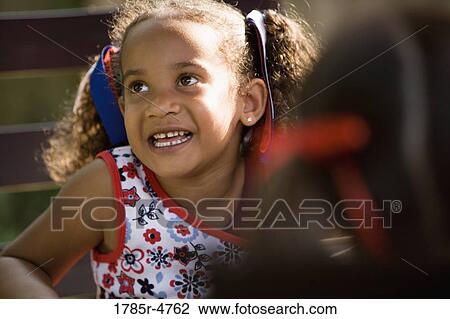 Close-up of a cheerful girl View Large Photo Image Stock Image - Close-up of a cheerful girl. Fotosearch