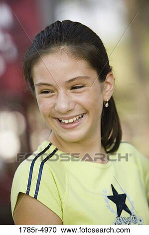 Stock Image - Close-up of a girl smiling. Fotosearch
