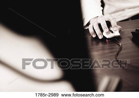 Close-up of a hand using computer mouse View Large Photo Image Stock Photo - Close-up of a hand using computer mouse. Fotosearch